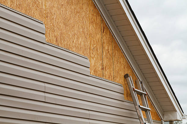Professional Siding Installation technician working in Montgomery Village, MD